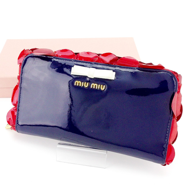 ■管理番号：T2030 ◆参考価格：円 【商品説明】 ミュウミュウ【miu miu】の 長財布です。 ガーリーなフリル＆リボン付き&star;ラウンドファスナー式で大きく開くのでお金の出し入れ