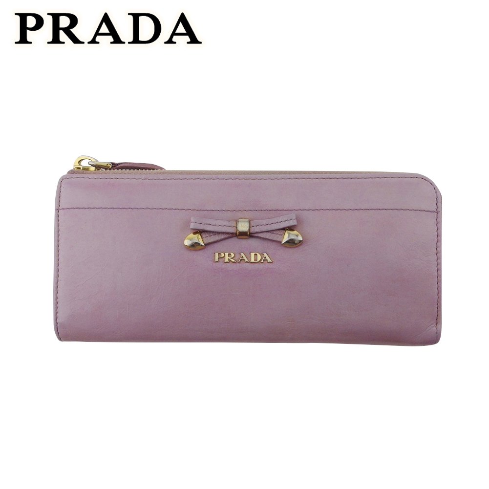 ■管理番号：T20440 ◆参考価格：円 【商品説明】 プラダ【PRADA】の 長財布です。 レディライクなリボンデザイン&star;L字ファスナー式で大きく開くのでお金の出し入れがスムーズに