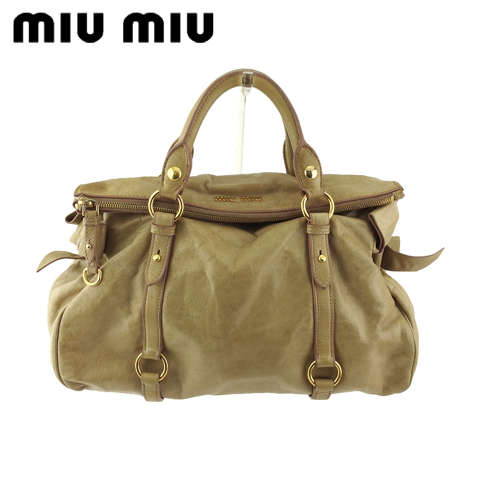 ■管理番号：T20672 ◆参考価格：円 【商品説明】 ミュウミュウ【miu miu】の ハンドバッグです。 ガーリーなサイドリボンデザイン&star;内側には鍵などの大切な物を入れるのに最適